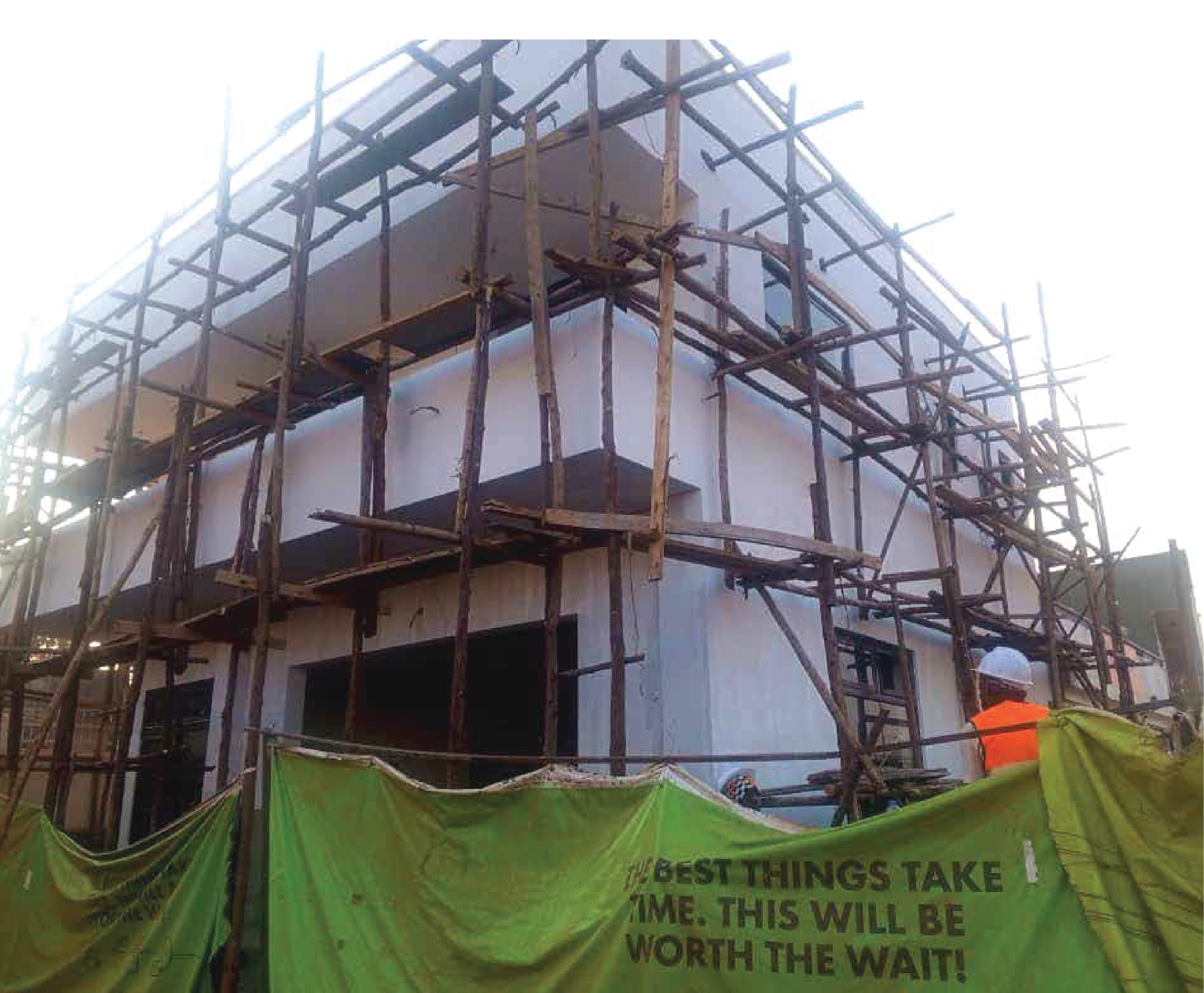Multi storey building under construction with scaffolding